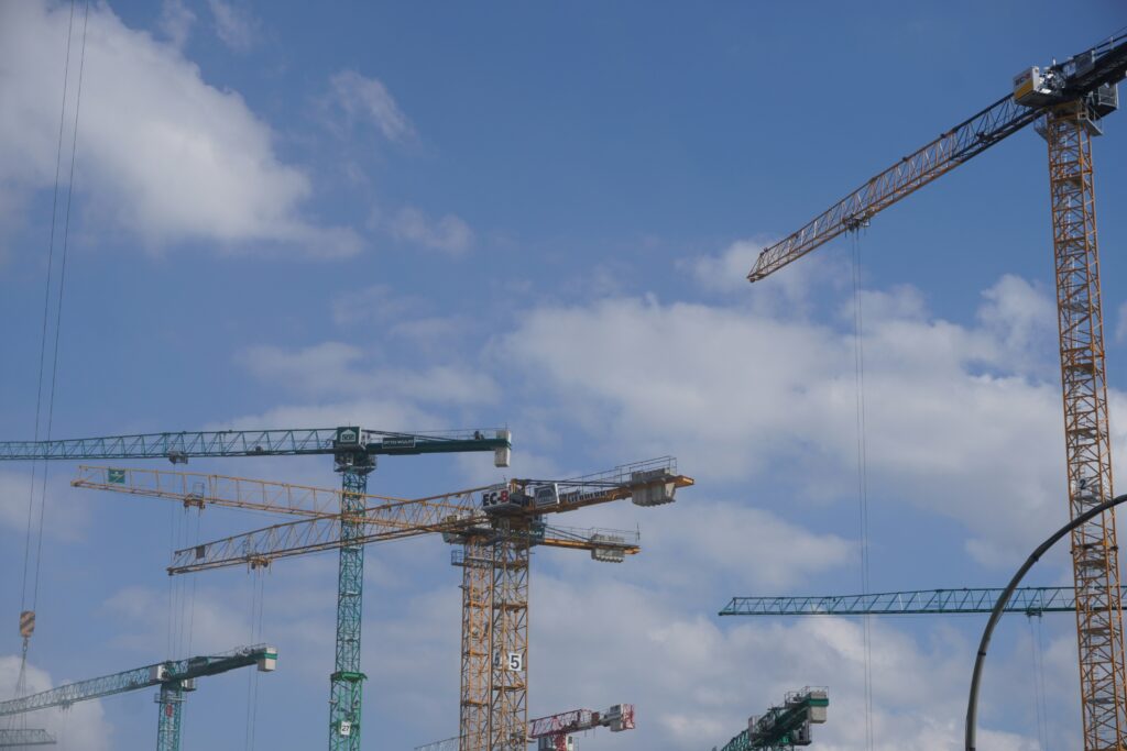 Several cranes on a construction site